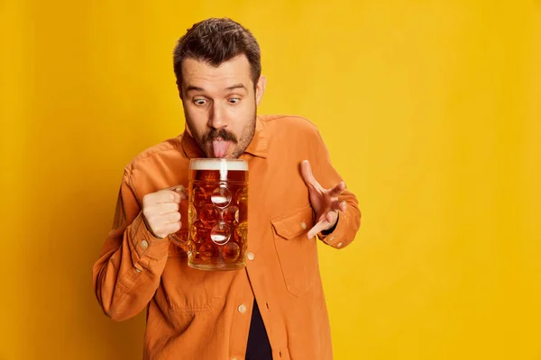 Tasting Tongue Emotive Man Orange Shirt Posing Lager Foamy Beer — Stock Photo, Image
