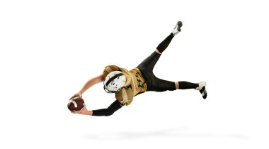 Flying, catching ball. Man, american football player in motion, training over white studio background. Top view. Concept of sport, movement, achievements, competition, hobby. Copy space for ad