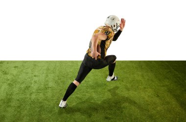 Man, american football player in motion, training, running on grass field over white studio background. Dynamics. Concept of sport, movement, achievements, competition, hobby