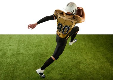 Man, professional american football player in motion, training, running with ball over white studio background with green grass flooring. Concept of sport, movement, achievements, competition, hobby