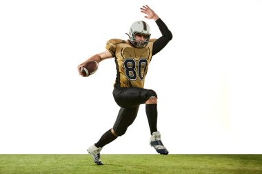 Man, professional american football player in motion, training over white studio background. Motivated sportsman. Concept of sport, movement, achievements, competition, hobby. Copy space for ad