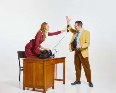 Angry talk. Businessman refusing talking on phone. Shouting with anger. Secretary holding phone handset. Irritation. Concept of business, professional relationship, communication, teamwork, occupation