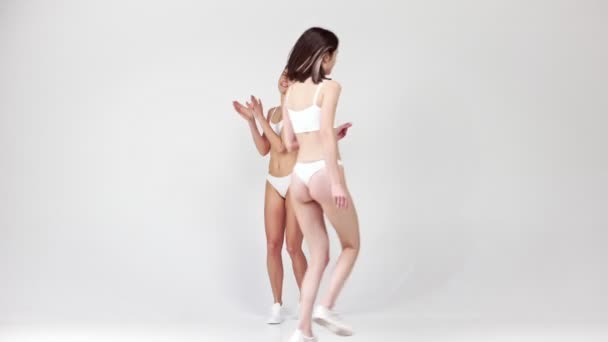 Entering Group Young Beautiful Girls Posing White Underwear Grey Studio — Wideo stockowe