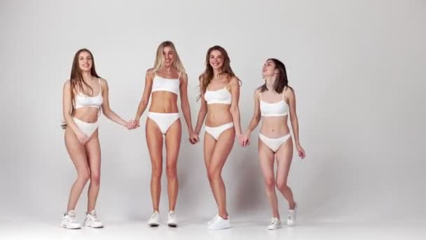 Jumping Slim Body Group Young Beautiful Girls Posing White Underwear — Stock videók
