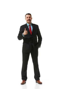 Businessman in a suit showing gesture of approvement and positivity over white studio background. Success. Concept of business, career development, ambitions, innovative strategy. Copy space for ad