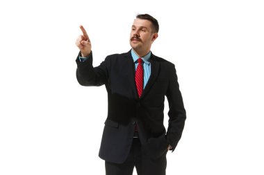 Businessman in a suit pointing with finger over white studio background. Checking project. Concept of business, career development, ambitions, innovative strategy. Copy space for ad
