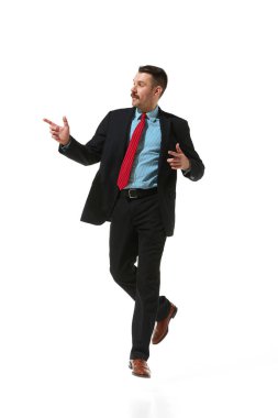 Businessman in a suit over white studio background. Reaching success, professional growth. Concept of business, career development, ambitions, innovative strategy. Copy space for ad