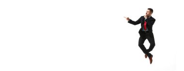 Businessman in a suit with thoughtful face jumping over white studio background. Banner, flyer. Concept of business, career development, ambitions, innovative strategy. Copy space for ad