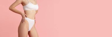 Cropped image of female body posing in cotton underwear. Slim fit body shape. Taking care after body. Concept of body and skin care, fitness, natural beauty, health. Banner, flyer. Copy space for ad