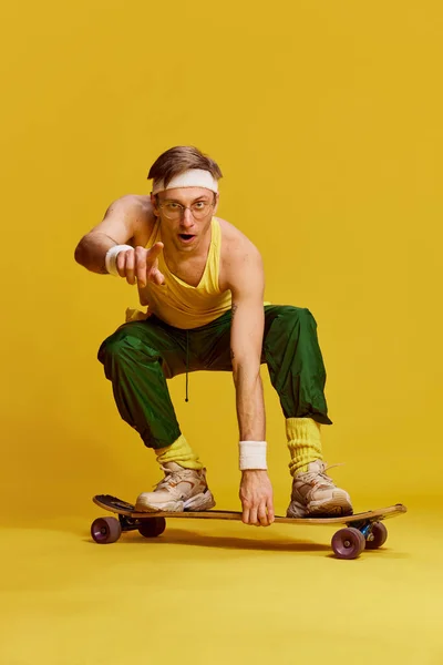 Portrait Young Cheerful Man Sports Uniform Posing Skateboard Bright Yellow — Stockfoto