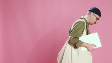 Successful project. Stylish man opening laptop and getting positive message, notification. Professional growth. Concept of emotions, business, occupation, lifestyle, mens fashion, mood. Ad