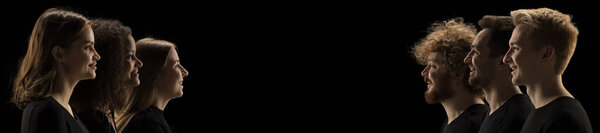Opposite opinion. Side view portraits of different people, men and women standing at different sides and looking at each other, smiling. Concept of human rights, freedom, diversity, inluence, equality