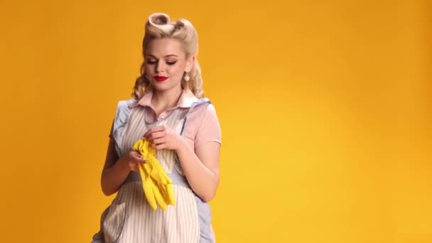 Beautiful Stylish Girl Housewife Retro Apron Putting Rubber Gloves Cleaning — Video