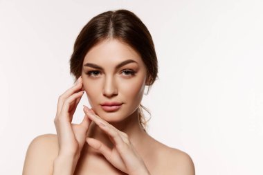 Portrait of young beautiful woman with perfect smooth skin over white background. Tenderness, sensuality and femininity. Concept of natural beauty, plastic surgery, cosmetology, cosmetics, skincare