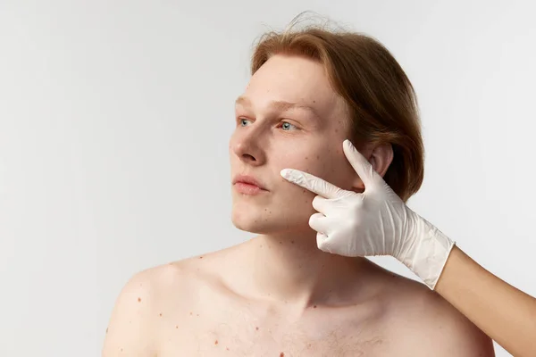 Face cosmetological injections. Young redhead man having medical check up with cosmetologist. Beauty treatment. Mens health, cosmetology, plastic surgery, body, skin care, hygiene, medicine concept