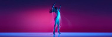 Freedom. Young woman dancing in bodysuit over gradient pink studio background in neon with mixed lights. Concept of contemporary dance style, art, aesthetics, hobby, creative lifestyle. Banner