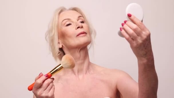 Beautiful Middle Aged Woman Well Kept Healthy Skin Applying Blusher — Video