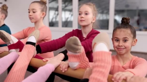 Group Little Girls Children Gymnasts Training Coach Indoors Stretching Exercises — Stock video