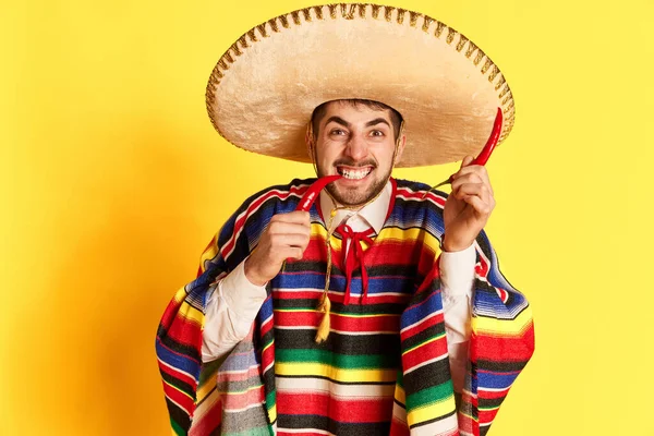 Emotional Young Man Colorful Festive Clothes Poncho Sombrero Posing Chilli — Stock Photo, Image