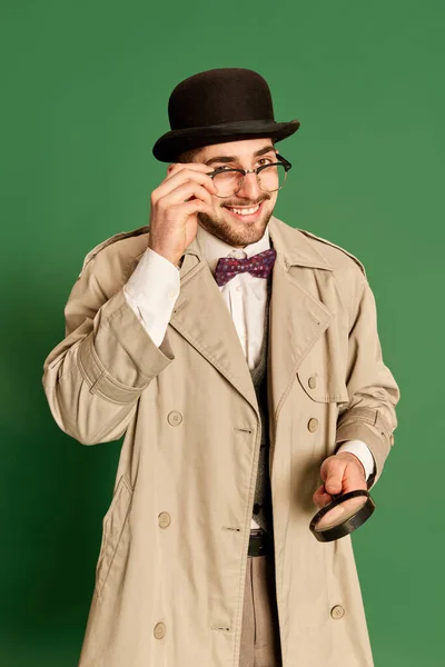 Portrait Young Smiling Man Stylish Trench Coat Hat Posing Magnifying — Stock Photo, Image