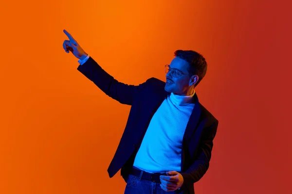 Portrait Young Man Employee Jacket Glasses Posing Pointing Finger Illusion — Stock Photo, Image