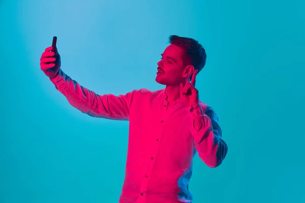 Portrait Young Man Shirt Taking Selfie Mobile Phone Blue Studio — Stock Photo, Image