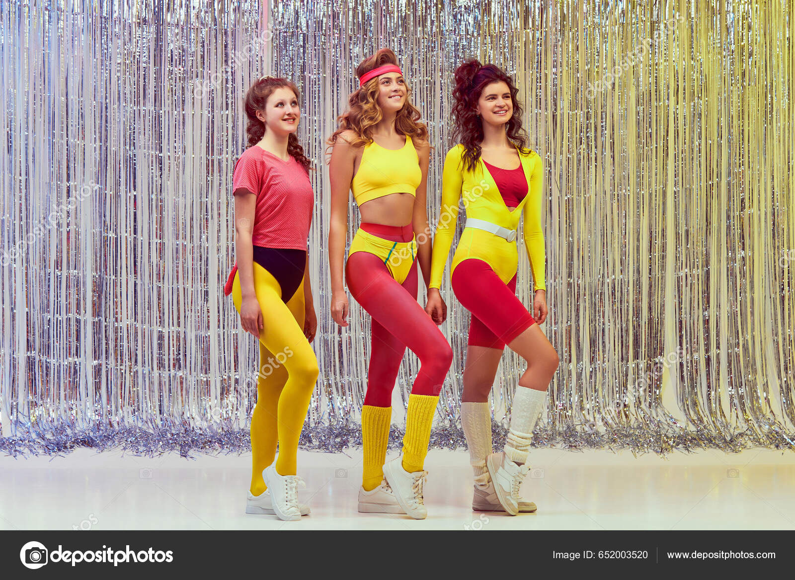 Three Smiling Beautiful Young Women Colorful Clothes Pink Yellow Leggings  Stock Photo by ©vova130555@gmail.com 652003520