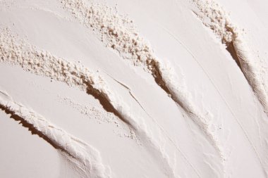 Pastel renkli duvar kağıdı, arkaplan, tasarım, pankart. Kumun yaratıcı görüntüsü, izli toz ve dokular. El salla. Yaratıcı sanat fotoğrafçılığı. Soyut doğa geçmişi. Minimalizm