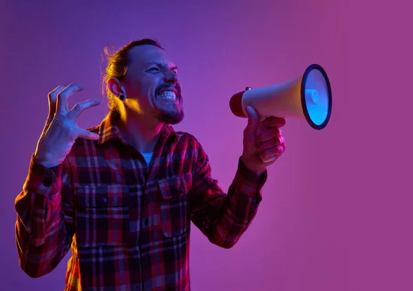 Portrait Angry Emotional Man Shouting Megaphone Annoyance Purple Studio Background — Stock Photo, Image