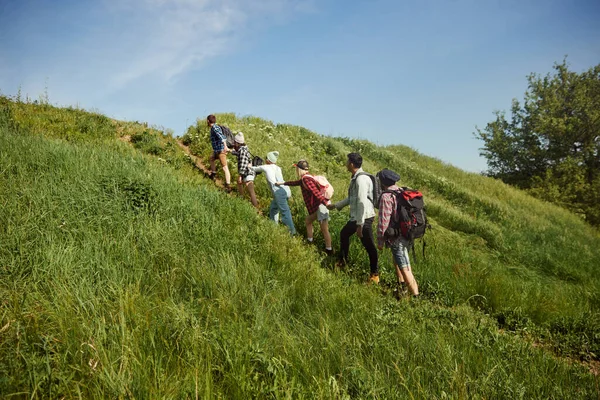 Group Young People Friends Walking Hill Warm Spring Day Men — Stock Photo, Image