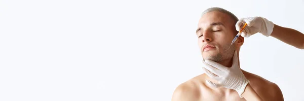 Handsome Young Man Doing Cosmetological Face Injections White Studio Background — Stock Photo, Image