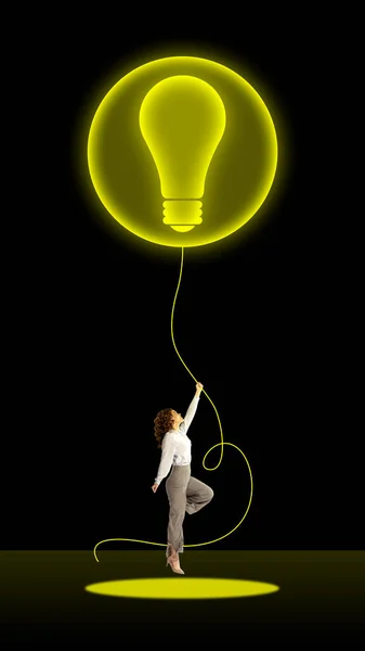 Young Woman Employee Holding Light Bulb Symbolizing Creative Professional Ideas — Stock Photo, Image