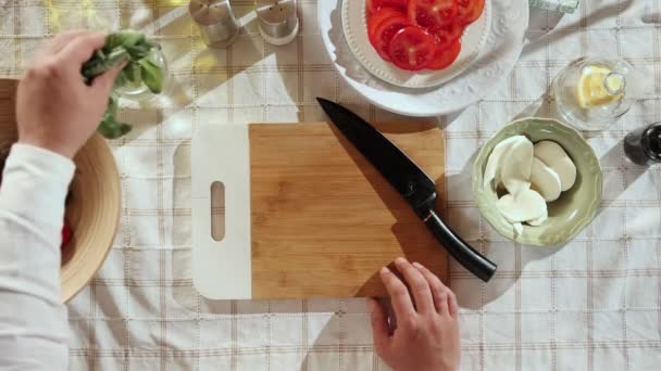 Caprese Salad Preparation Top View Image Mans Hands Cutting Basil — Stock Video