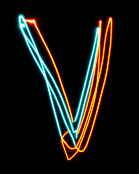 Letter V of the alphabet made from neon sign. The blue red light image, long exposure with colored fairy lights, against a black background. Concept of design
