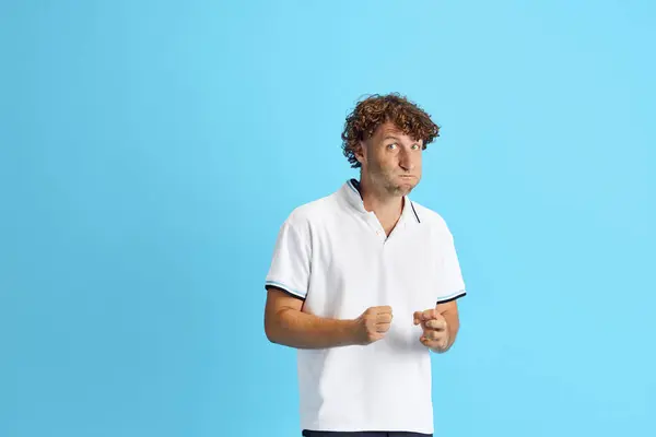 Curly Man Casual White Shirt Showing Irritation Blue Studio Background — Stock Photo, Image
