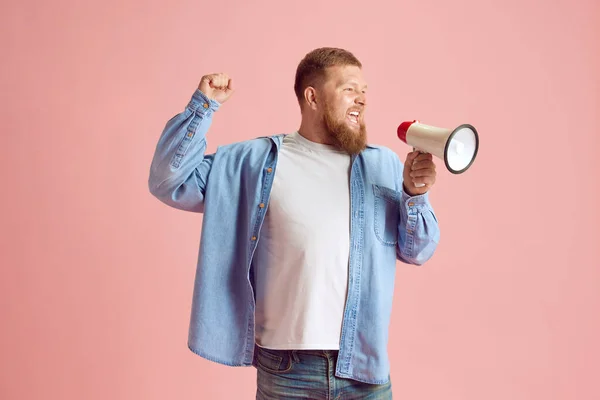 Bearded Emotional Man Casual Clothes Shouting Megaphone Pink Studio Background — Stock Photo, Image