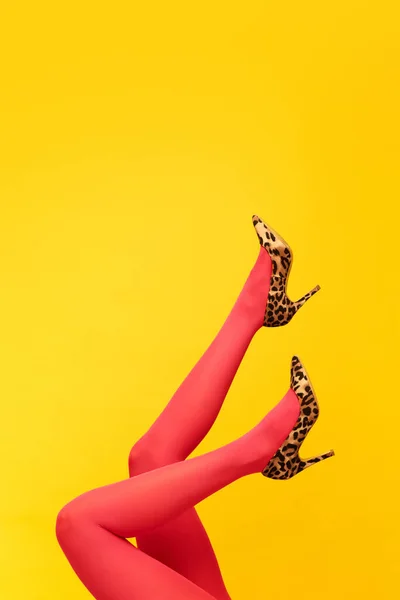 Female Slender Legs Wearing Stylish Heeled Shoes Animal Print Red — Stock Photo, Image