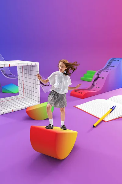 Little girl, child playing on 3D items of school supplies, balancing on eraser. School lessons and adventures. Concept of childhood, education, school, lifestyle, knowledge. Colorful collage.