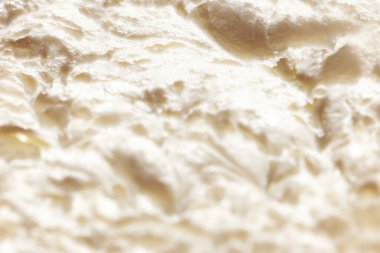 Erimiş dondurmanın yakın plan görüntüsü. Vanilya doğal dondurma dokusu. Yiyecek, kahvaltı, sağlıklı beslenme ve atıştırmalıklar, organik, ev yapımı ürünler