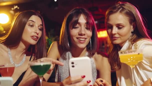 Beautiful Women Friends Meeting Bar Looking Mobile Phone Discussing Smiling — Stock Video