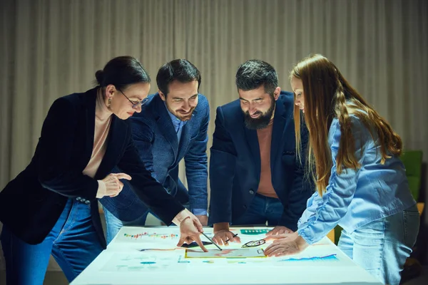 Business people managers meeting in briefing room to work on projects strategy for development and promotion. Checking analytics, data and statistics. Concept of business, teamwork, modern office