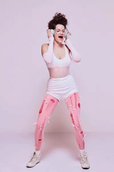 Stylish Young Woman Listening Music Headphones Emotionally Singing Pastel Pink — Stock Photo, Image