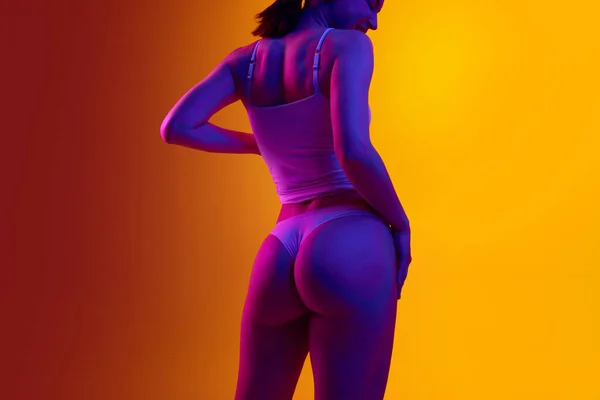 Cropped Image Slim Woman Fit Smooth Buttocks Orange Background Purple — Stock Photo, Image