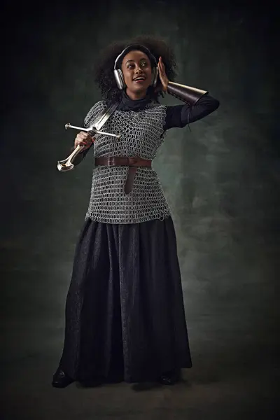 Young African Woman Medieval Warrior Chainmail Armor Sword Listening Music — Stock Photo, Image