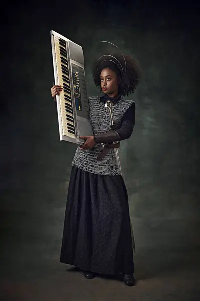 African Young Woman Medieval Warrior Chainmail Halo Holding Electronic Keyboard — Stock Photo, Image