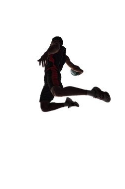 Spirit of competitive sports. Silhouette of basketball player in motion with ball during jump isolated on white background. Concept of professional sport, competition, game, tournament, action clipart