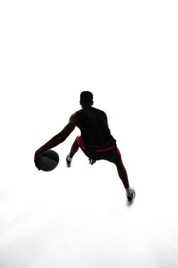 Silhouette of basketball player in motion with ball, make athlete playing isolated on white background. Concept of professional sport, competition, game, tournament, action clipart
