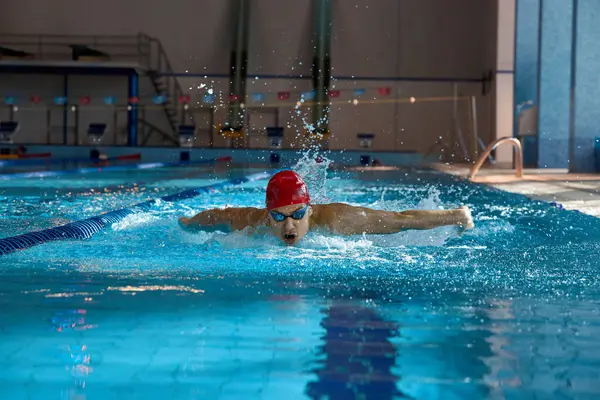 Young Man Red Cap Goggles Swimmer Motion Showing Butterfly Stroke — Stock Photo, Image