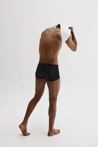 Full Length Image Muscular Young Man Underwear Taking Shirt Showing – stockfoto