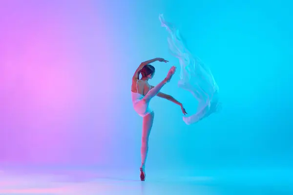 Graceful Ballet Artist Performing White Fabric Action Neon Light Vivid — стоковое фото